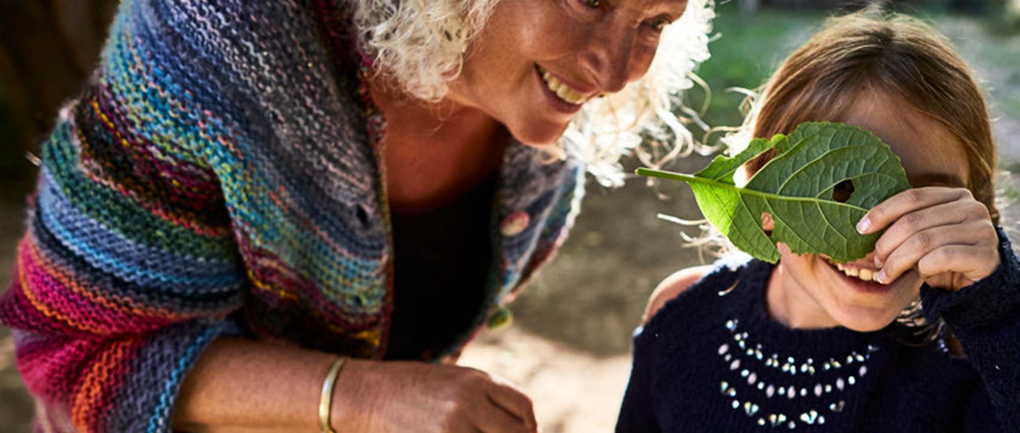 Smiling old woman with a child